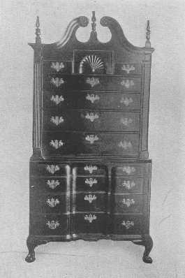 A very rare block-front chest of drawers with the
original brasses.