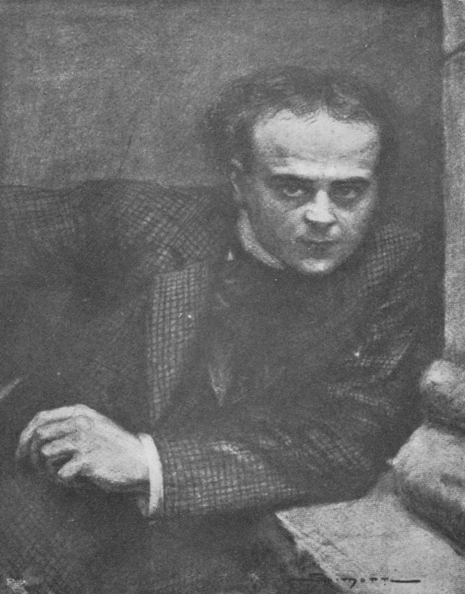 A portrait of a young man,
    dressed in a suit and leaning against a chimney-piece.