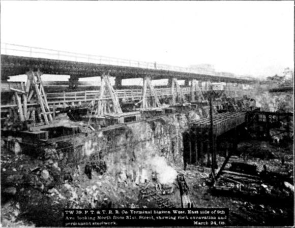 Plate XLVIII, Fig. 2.&mdash; TW 39, P.T. & T.R.R. Co. Terminal Station West. East side of 9th Ave. looking North from 31st Street, showing rock excavation and permanent steel work. March 24, 08.