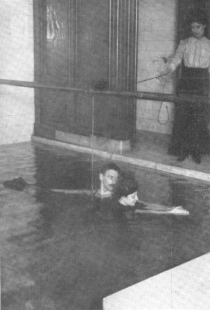 THE BREAST STROKE&mdash;TEACHING WITH TROLLEY AND INSTRUCTOR