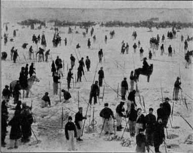 Fishing for sturgeon through the ice of the Ural River. Catching the material for caviare