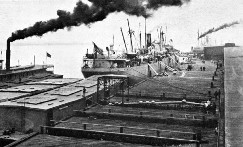 In Foreground&mdash;Loading Coffee by Means of an Automatic Traveling-Belt Conveyor, on Government Barges for St. Louis