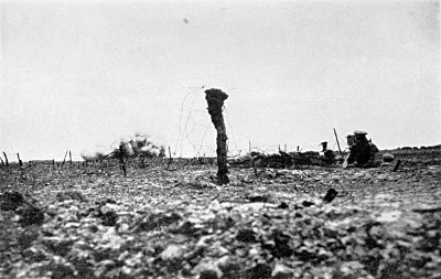 IN A SHELL HOLE IN "NO MAN'S LAND" FILMING OUR HEAVY BOMBARDMENT OF THE GERMAN LINES. I GOT
INTO THIS POSITION DURING THE NIGHT PREVIOUS. IT WAS HERE THAT I EARNED THE SOUBRIQUET "MALINS
OF NO MAN'S LAND"