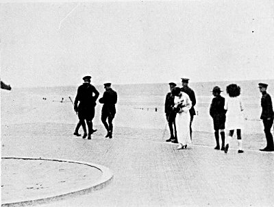 HER MAJESTY, THE QUEEN OF THE BELGIANS, TAKING A SNAP OF ME
AT WORK WHILE FILMING THE KING