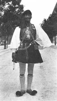 AND BLUE JACKET ORNAMENTED WITH
MANY BRASS BUTTONS.