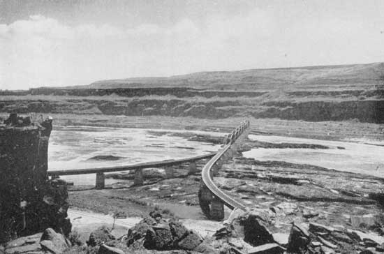 Where the Oregon Trunk Railway crosses the Columbia. "The
river rolls between banks of barrenness"
