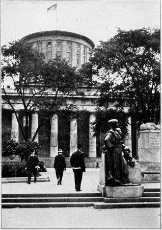 Looking into the State House grounds toward the broad
flight of steps before the west front of the building